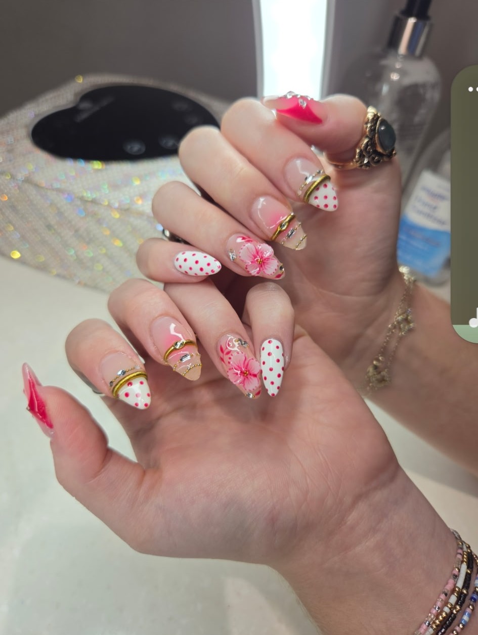 Long nails combining sculpted 3D flowers, gem charms, gold wire and polka dots